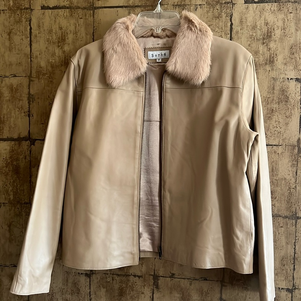 Leather jacket with “fur” collar.